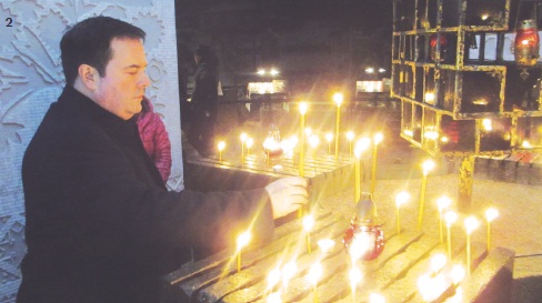2) Min. Kenney lighting a candle at the Ukrainian National Holodomor Memorial to the millions of victims killed in the Famine Genocide 1932-1933.