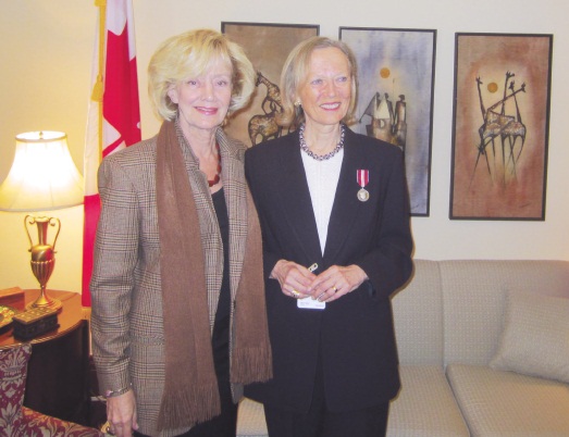 Irena Bell (right) received Jubilee Medal presented by Sen. Raynell Andreychuk