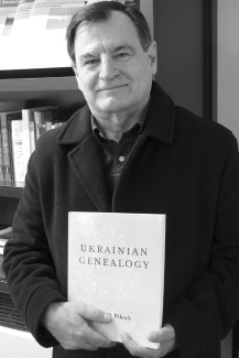 John Pihach displaying his CIUS Press best-seller, Ukrainian Genealogy: A Beginner’s Guide