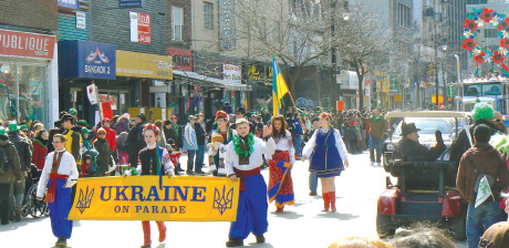 Ukrainian participants in Montreal’s St. Patrick’s Day Parade with award-winning float in background