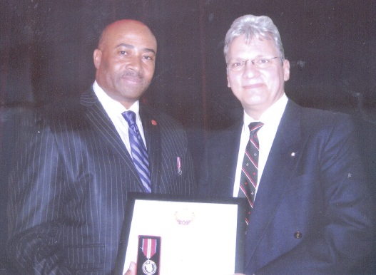 L. to R.: Senator, Honourable Dr. Don Meredith, presented the Jubilee Medal to Dr. Michael Boyko