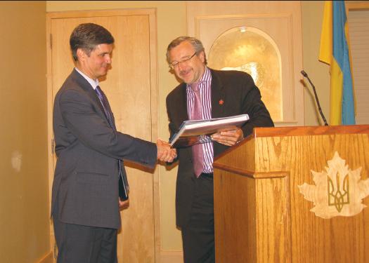 3 - R. to L.: Zenon Potichny presents a gift to His Excellency, Ambassador of Ukraine in Canada, Vadym Prystaiko