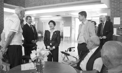 L to R: Fred Bilasz, President, Care Centre Residents Council; Ted Opitz, MP Etobicoke Centre; Minister Alice Wong; Bernard Trottier, MP Etobicoke Lakeshore; Alexander Daschko, President and Board Chair, St. Demetrius Development Corporation; and seated, resident William Chaboryk
