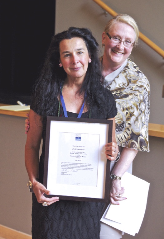 From L. to R.: Dr. Joan Clayton holding Kobzar Writer's Scholarship presented by Dr. Christine Turkewych