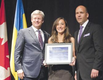 2 - UCC Youth Leadership Award recipient Kristin Glover (centre) with PM Harper (left) and Paul Grod (right)