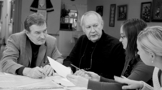 (L. to R.): Stefan Horodeckyj, UCSS (Toronto) Executive Director, discussing the contents of the “Sunbeam” Newsletter with his staff: Alex Chumak; Olena Lezhanska; and Olena Nebesna