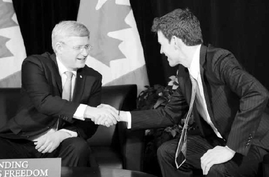  Prime Minister Stephen Harper shakes hands with Dr. Andrew Bennett as he is named ambassador to the Office of Religious Freedom in Vaughan, Ont., north of Toronto